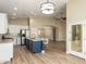 Spacious open concept kitchen boasts stainless steel appliances, large island, and bright natural light at 2156 E Aloe Pl, Chandler, AZ 85286
