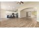 Open-concept living room featuring hardwood floors and seamless flow into the kitchen and dining areas at 2156 E Aloe Pl, Chandler, AZ 85286