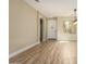 Inviting living room with natural lighting, hardwood floors and open entry featuring the front door and dining area at 2156 E Aloe Pl, Chandler, AZ 85286