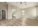 Primary bedroom with vaulted ceilings, vinyl flooring, neutral paint, and ensuite bathroom at 2156 E Aloe Pl, Chandler, AZ 85286