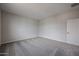 Simple bedroom with neutral walls and carpeting at 2646 E Bluff Spring Ave, Apache Junction, AZ 85119