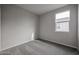 Bright bedroom with neutral walls and carpet at 2646 E Bluff Spring Ave, Apache Junction, AZ 85119