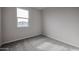 Simple bedroom with a window and neutral walls at 2646 E Bluff Spring Ave, Apache Junction, AZ 85119
