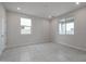 Bedroom with tile floors and two windows at 2646 E Bluff Spring Ave, Apache Junction, AZ 85119
