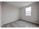Spacious bedroom with large window and carpet at 2646 E Bluff Spring Ave, Apache Junction, AZ 85119