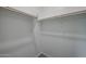 Spacious closet with wood shelving and hanging rods at 2646 E Bluff Spring Ave, Apache Junction, AZ 85119