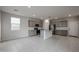 Open concept kitchen with gray cabinets and granite countertops at 2646 E Bluff Spring Ave, Apache Junction, AZ 85119