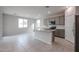 Open-concept kitchen with gray cabinets and granite island at 2646 E Bluff Spring Ave, Apache Junction, AZ 85119