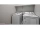 Bright laundry room with washer and dryer included at 2646 E Bluff Spring Ave, Apache Junction, AZ 85119