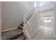 Modern staircase with white railing and gray carpeting at 2646 E Bluff Spring Ave, Apache Junction, AZ 85119
