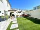 Manicured backyard with artificial grass and patio with a patio covering. Great for gatherings! at 6437 N 17 St, Phoenix, AZ 85016