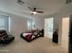 Bedroom with a ceiling fan, neutral carpet and ensuite bathroom at 6437 N 17 St, Phoenix, AZ 85016
