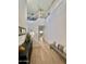 Bright entryway with high ceilings, modern chandelier, staircase and wood-look tile flooring at 6437 N 17 St, Phoenix, AZ 85016