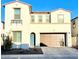 Charming two-story home with a welcoming blue front door and a two-car garage at 6437 N 17 St, Phoenix, AZ 85016