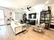 Open living room featuring modern furniture, a ceiling fan, and tile flooring at 6437 N 17 St, Phoenix, AZ 85016