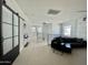 Bright upstairs loft space features a full size couch and a sliding door to the bedroom at 6437 N 17 St, Phoenix, AZ 85016