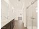 Bathroom with double vanity and walk-in shower at 16006 W Cottontail Ln, Surprise, AZ 85387
