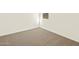 Well-lit bedroom with carpeted floors at 16006 W Cottontail Ln, Surprise, AZ 85387