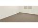 Bright bedroom with neutral carpeting and large window at 16006 W Cottontail Ln, Surprise, AZ 85387