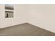 Spacious bedroom with window and carpet at 16006 W Cottontail Ln, Surprise, AZ 85387