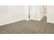 Spacious bedroom with carpet and access to bathroom at 16006 W Cottontail Ln, Surprise, AZ 85387