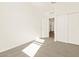 Bright bedroom with double door closet and carpet at 16006 W Cottontail Ln, Surprise, AZ 85387