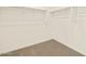 Large walk-in closet with double hanging rods at 16006 W Cottontail Ln, Surprise, AZ 85387