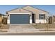 One-story home with a dark gray garage door and light colored exterior at 16006 W Cottontail Ln, Surprise, AZ 85387