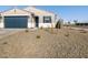 Newly built home with desert landscaping and a two-car garage at 16006 W Cottontail Ln, Surprise, AZ 85387