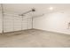 Clean and spacious garage with automatic door opener at 16006 W Cottontail Ln, Surprise, AZ 85387