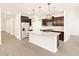 Modern kitchen with stainless steel appliances and an island at 16006 W Cottontail Ln, Surprise, AZ 85387