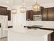Modern kitchen with stainless steel appliances and an island at 16006 W Cottontail Ln, Surprise, AZ 85387