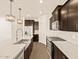 Modern kitchen with stainless steel appliances and an island at 16006 W Cottontail Ln, Surprise, AZ 85387