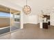 Open concept kitchen and dining area with modern fixtures and tile floors at 16006 W Cottontail Ln, Surprise, AZ 85387