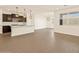 Modern kitchen and dining area with an open floor plan at 16006 W Cottontail Ln, Surprise, AZ 85387