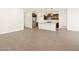Open floor plan showcasing kitchen, island, and living room at 16006 W Cottontail Ln, Surprise, AZ 85387