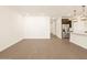 Bright living area with wood-like tile flooring and kitchen views at 16006 W Cottontail Ln, Surprise, AZ 85387