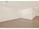 Spacious living room with wood-look tile floors and recessed lighting at 16006 W Cottontail Ln, Surprise, AZ 85387