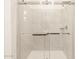 Large walk-in shower with glass enclosure at 16006 W Cottontail Ln, Surprise, AZ 85387