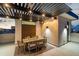 The covered patio features a dining area with modern lighting and a pergola that offers some shade from the sun at 377 E Windsor Ave # 21, Phoenix, AZ 85004