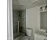 Updated bathroom featuring a shower with marble-style tiling at 18202 N Cave Creek Rd # 107, Phoenix, AZ 85032