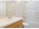 Cozy bathroom with a bathtub and a vanity with wooden cabinets at 4799 W Flat Iron Ct, Queen Creek, AZ 85144