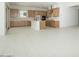 Bright open-concept kitchen features wooden cabinets and a white center island at 4799 W Flat Iron Ct, Queen Creek, AZ 85144