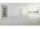 Spacious living room with neutral paint, tile floors, and bright natural light at 4799 W Flat Iron Ct, Queen Creek, AZ 85144