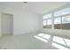Bright and open living room with large windows providing abundant natural light at 4799 W Flat Iron Ct, Queen Creek, AZ 85144