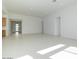 Spacious living room featuring neutral tones, tile floors, and bright natural light at 4799 W Flat Iron Ct, Queen Creek, AZ 85144