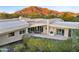 Aerial view features a home with a pool, outdoor seating, desert landscaping, and mountain views at 6301 N 51St Pl, Paradise Valley, AZ 85253