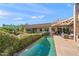 Backyard featuring covered patio, pool, and desert landscape at 6301 N 51St Pl, Paradise Valley, AZ 85253