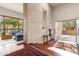 Bright entryway features stone wall, hardwood floors, and view to the living room at 6301 N 51St Pl, Paradise Valley, AZ 85253
