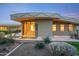 Exterior features a small water feature, desert landscaping, and a patio with outdoor seating at 6301 N 51St Pl, Paradise Valley, AZ 85253